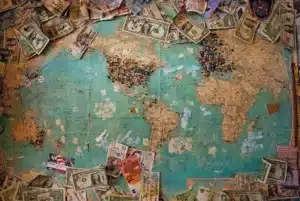 A demystifying map of the world featuring cross-border payments covered in money.