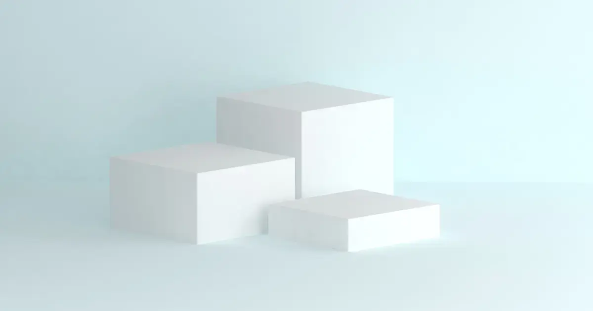 Three white cubes on a light blue background.