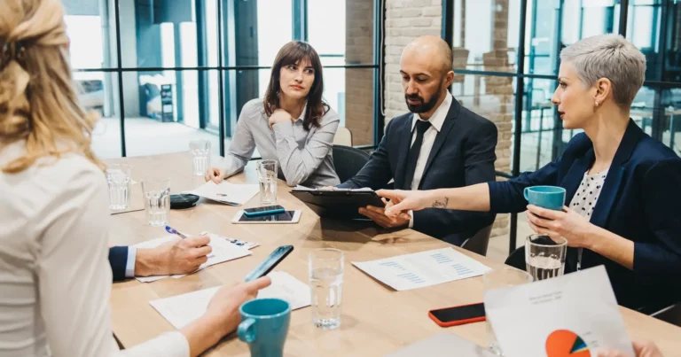 A group of business people having a meeting in a conference room.