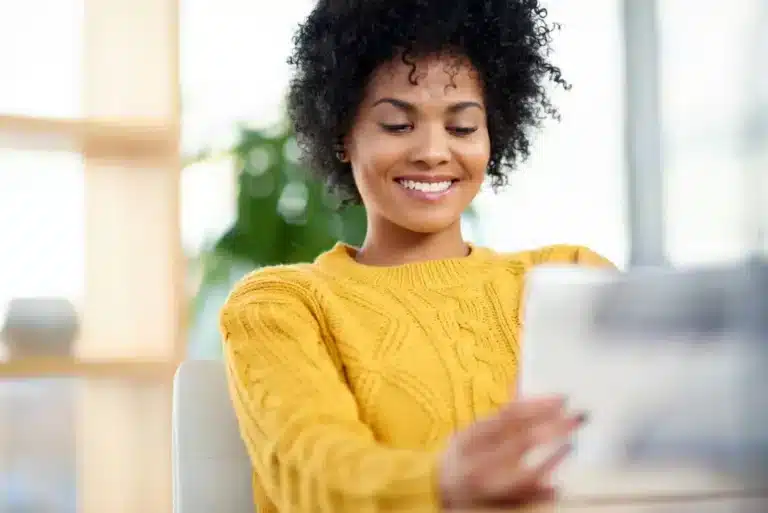 Young african american woman looking at a tablet computer.