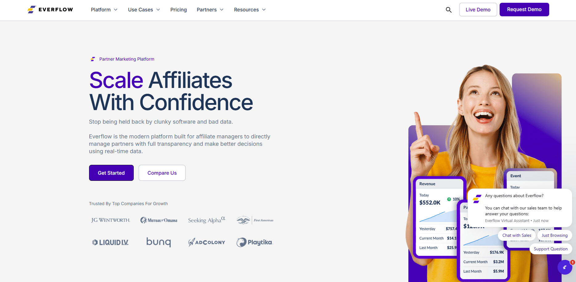 Screenshot of Everflow’s homepage featuring a woman smiling and pointing upward, company logos, and overlay graphics of dashboards and chat support. Text highlights affiliate marketing tools on this leading performance marketing platform.