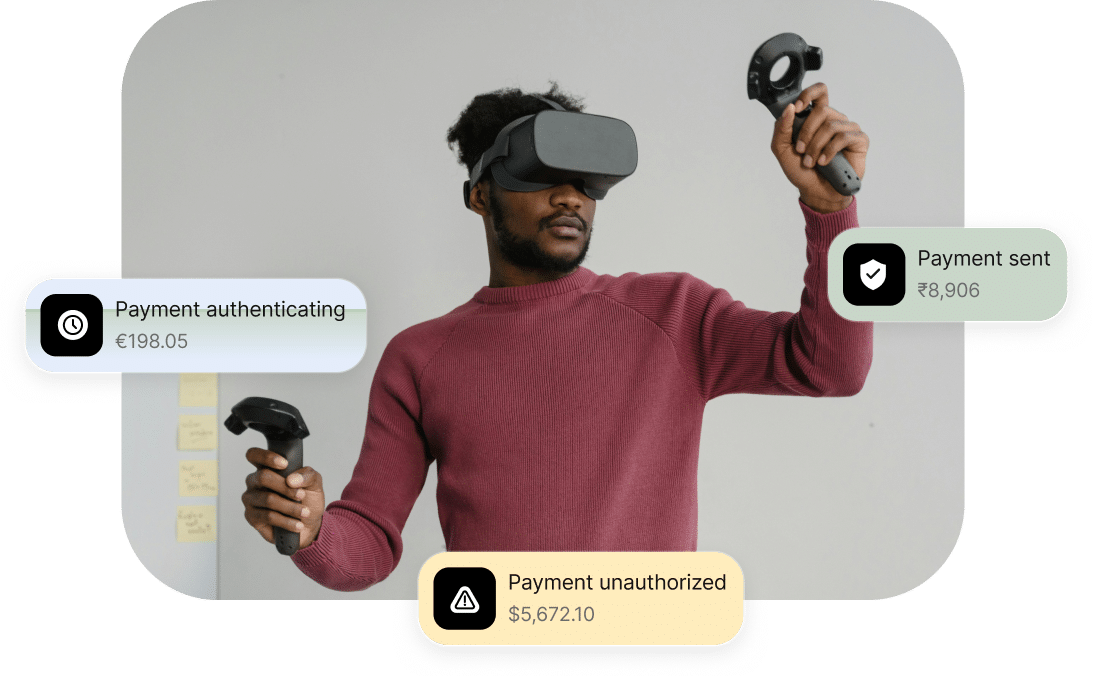 A person wearing a VR headset and holding controllers, with three notifications around them: "Payment authenticating €198.05," "Payment sent ₹8,906," and "Payment unauthorized ,672.10.