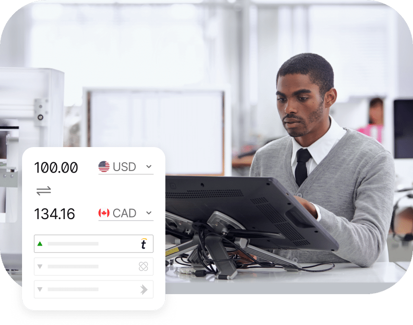 A man in business attire works on a computer. A digital currency converter showing 100 USD equals 134.16 CAD is displayed in the foreground.