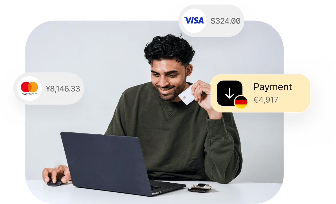 A person sitting at a table, holding a credit card and using a laptop. Payment amounts in different currencies are shown around him: ¥8,146.33, €4,917, and $324.00.