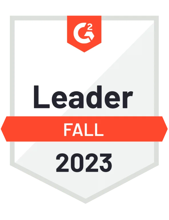 G2 badge displaying "Leader Fall 2023" in black and orange text on a white shield-shaped background.